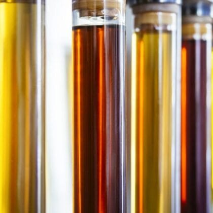used oils in containers, highlighting the importance of proper storage and recycling
