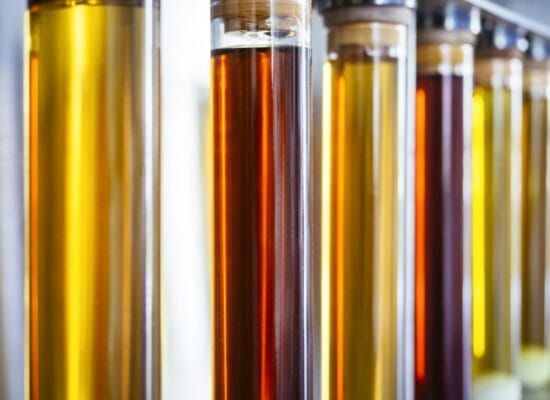 used oils in containers, highlighting the importance of proper storage and recycling